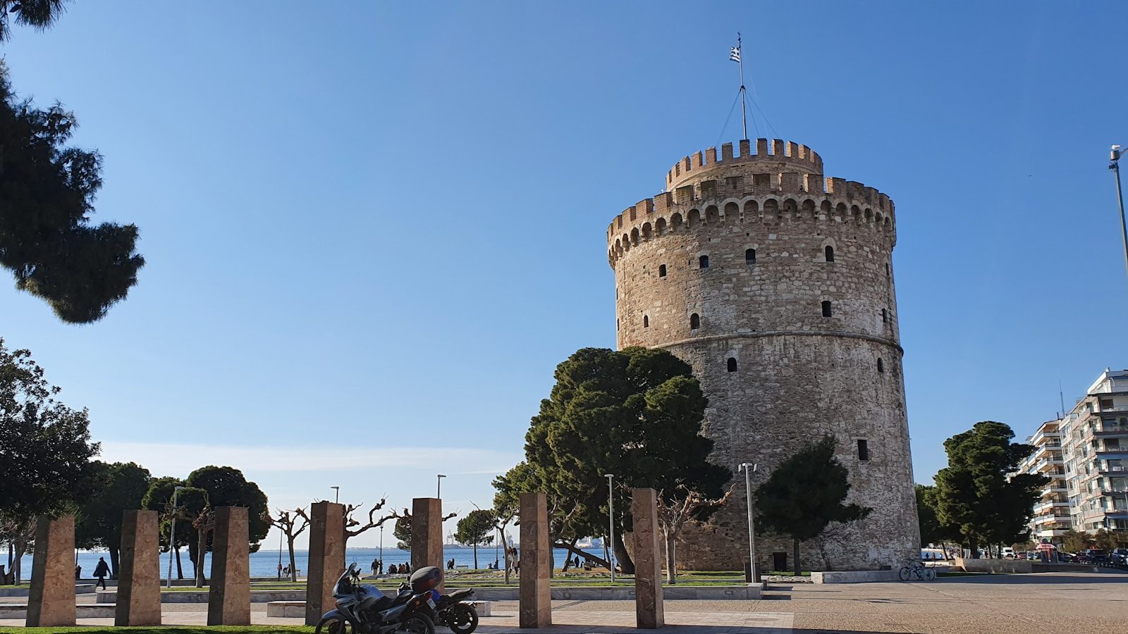 people walking on street near brown concrete building during daytime