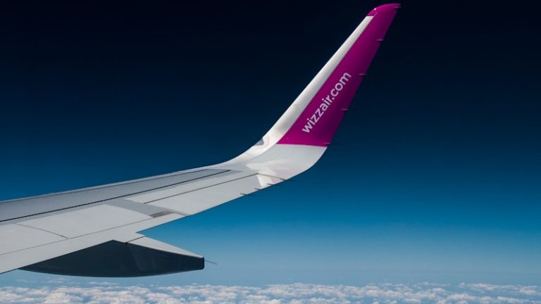 view of planes wings above clouds