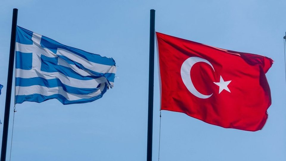 Flags of kosovo, greece, turkey, and usa waving