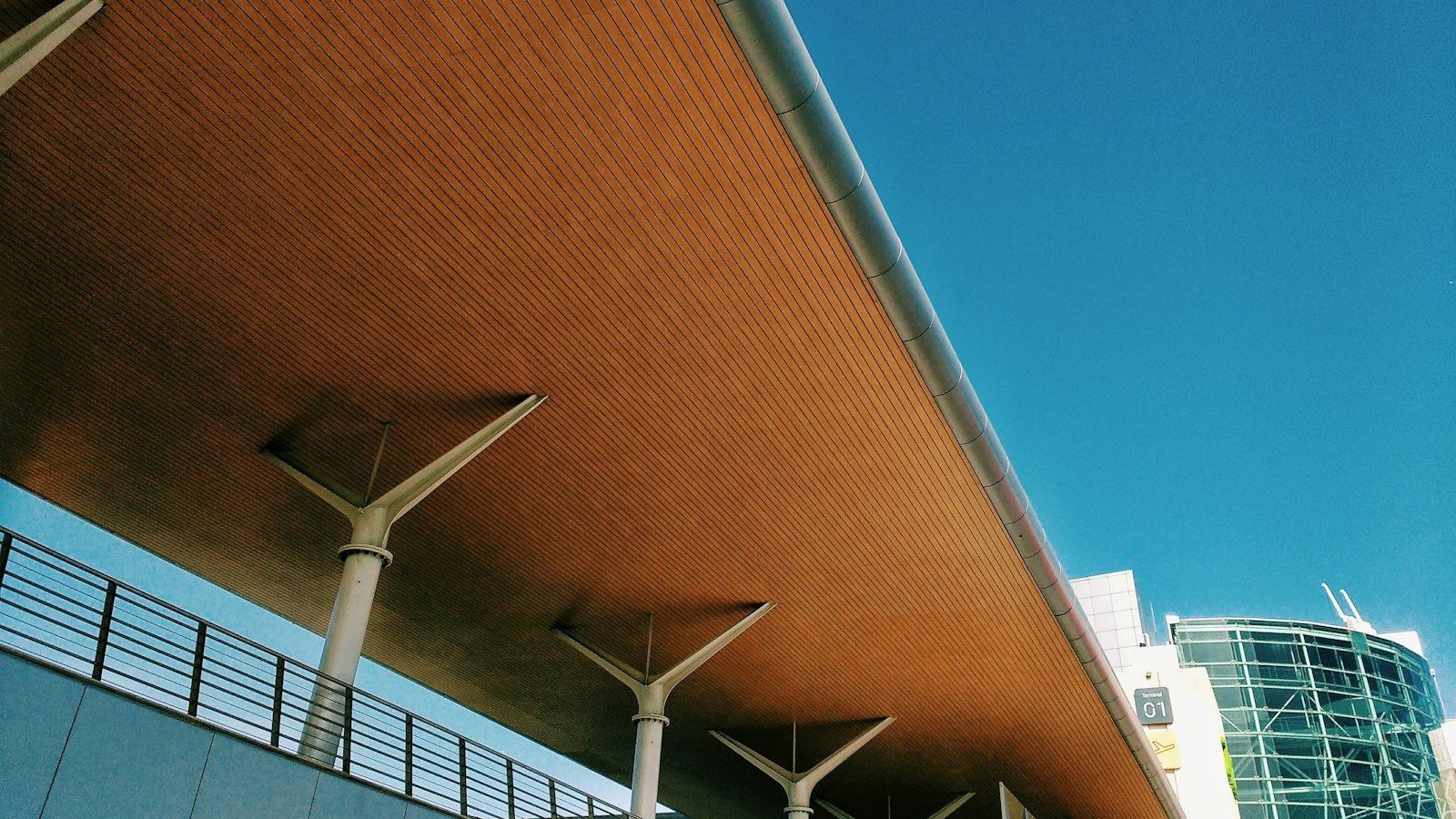 a view of a bridge with a building in the background